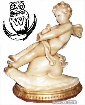 cupid-figurine-with-owl-wittman-roth-mark